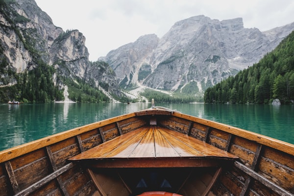 A wooden boat on a mountain lake